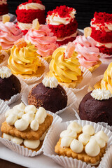 Pastry shop display window with variety of mini desserts and cakes
