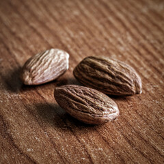 Brown nuts on the kitchen table close-up.