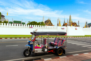 Thailand Tuk Tuk at Grand Palace with blue sky