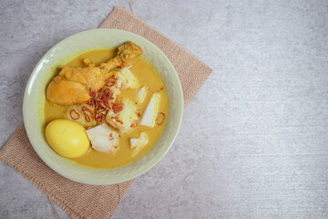Opor Ayam (Chicken Curry) and Ketupat Lebaran (Rice Cake). Special Eid celebratory dish from Indonesia and Malaysia.