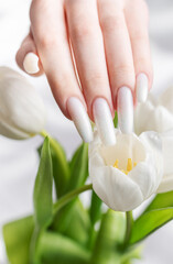 Female hand with spring nail design.