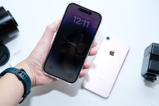 Kuala Lumpur Malaysia -April 2023. Buying New iPhone 14 Pro to replace old iPhone 7