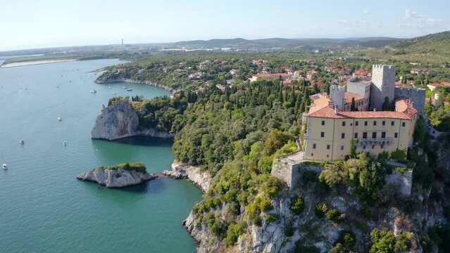 4K aerial - a bird's eye view&nbsp;video (Ultra High Definition) of Duino Castle. Attractive morning scene of Adriatic coast of Italy, Europe. Wonderful cityscape of Duino town.