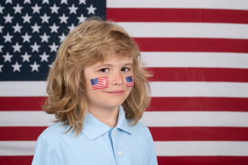 Child celebration independence day 4th of july. United States of America concept. Sign of american flag on child cheek. Fourth of july and children concept.