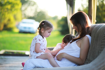 The family is resting in nature. Vacations in the fresh air. Weekend children play in the park.