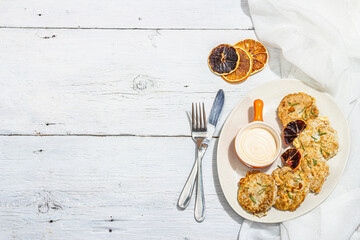 Hake fillet fried in batter. Sauce, fresh rosemary, dry lemon slices. Vegetarian food concept