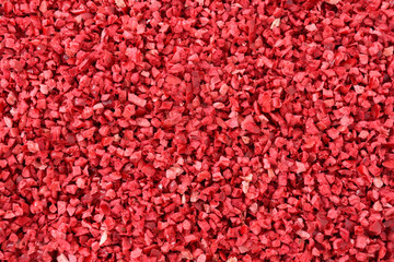 Obraz premium Freeze Dried Cranberry Pieces. Premium Freeze-Dried Fruit. Dried Cranberry background top view. Sweet dehydrated fruits. Cranberry Pattern. Cranberry Texture. red food texture.