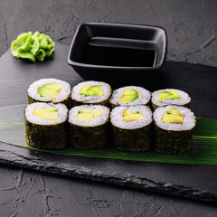 Delicious sushi maki with avocado on black © AntAlexStudio