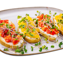 bruschetta with cream cheese and multi-colored grilled bell pepper