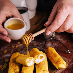 Sweet rolled pancakes with cottage cheese