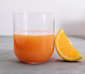 two glasses of orange and pear juice
