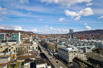 Aerial view of skyline of Industrial district of City of Zürich with multi line highway on a blue...