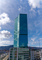 Fototapeta premium Prime Tower skyscraper at industrial district of City of Zürich on a blue cloudy winter noon. Photo taken March 9th, 2023, Zurich, Switzerland.