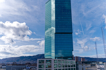Fototapeta premium Prime Tower skyscraper at industrial district of City of Zürich on a blue cloudy winter noon. Photo taken March 9th, 2023, Zurich, Switzerland.