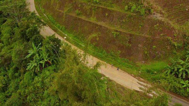 Drone shot of athletes racing through running