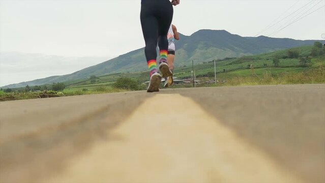 Worm's eye view of athletes running