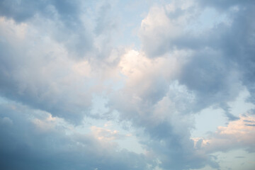 cumulus clouds in dawn sky. natural blue background