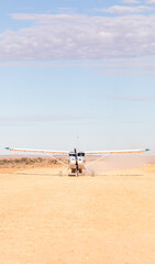 Fototapeta na wymiar Aeroplane landing in outback Australia