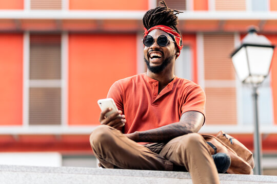 Smiley Afro Boy Using Phone