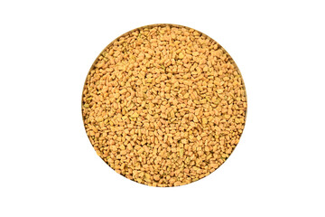 Top view of Fenugreek seeds (methi dana, hulba, heyseed, dari) on white background. raw fenugreek seeds isolated on white, top view. Pile of Fenugreek seeds isolated on white background.