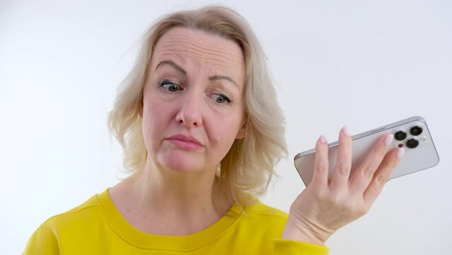 a woman is talking on the phone in touch hung up she is disappointed surprised raised her eyebrows shrugged her shoulders Well if there is nothing to be done spread her arms to the sides