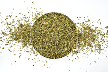 Natural dried mint herb (Mentha). Closeup on a Pile of Whole Dry (Dried) Mint Leaves. Isolated on...