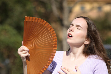 Woman in summer suffering heat stroke