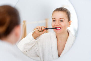 woman brushing  teeth