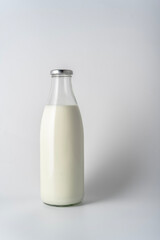 milk in glass bottle Isolated on white background