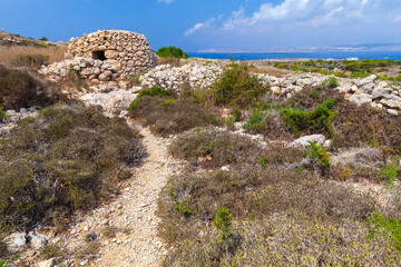 Fototapeta na wymiar Landscape with an old abandoned stone hut located in Mellieha, Malta