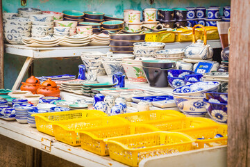 Close up of a collection of Asian crockery for sale at a market stall at Hue in Vietnam