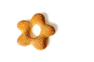 One cookie in shape of star on white background close-up