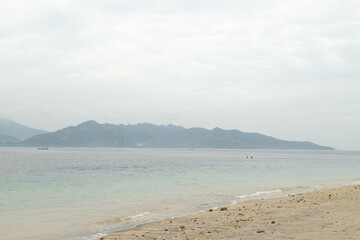 Fototapeta na wymiar Lombok and Gili Air islands, overcast, cloudy day, sky and sea. Sunny day, sand beach.