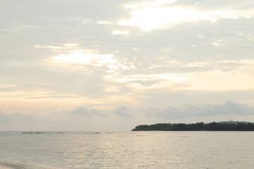 Naklejka na ściany i meble Lombok and Gili Air islands, overcast, cloudy day, sky and sea. Sunset, sand beach.