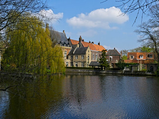 Fototapeta na wymiar Bruges, April 2023: Magnificent facades of the buildings of Bruges, the Venice of the North