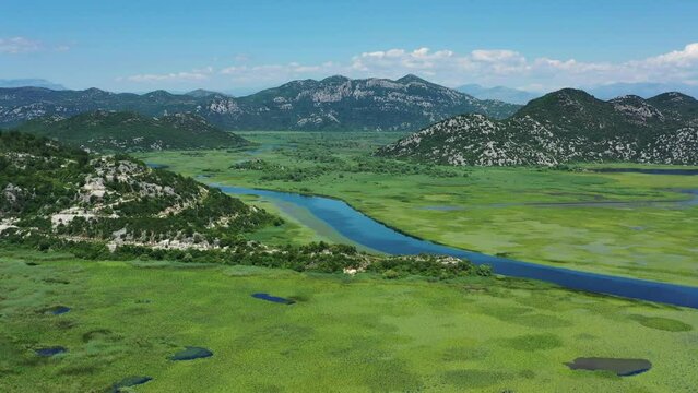 Aerial view of beautiful Skadar Lake between mountains at summer, Montenegro, 4k