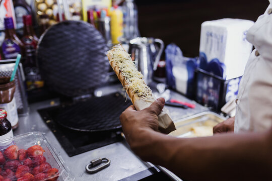 hand preparing Marquesitas mexican dessert traditional in Yucatan and Cancun Mexico in Latin America, Marquesita