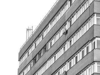 Fototapeta premium New reconditioned old communist apartment building. Ugly traditional communist housing ensemble. Abstract minimalist photography
