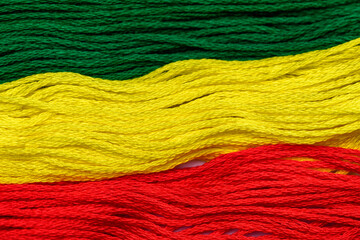 Włóczka w zbliżeniu makro, flaga reggae i Etiopii 