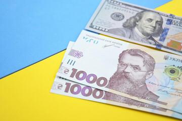 American dollars and Ukrainian hryvnia. The concept of the American aid to Ukraine in the war.