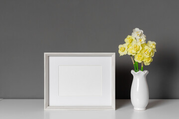 Blank landscape frame mockup with daffodils flowers