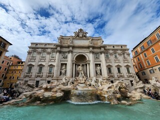 Fototapeta na wymiar Trevi fountain in Rome, Italy against the cloudy sky