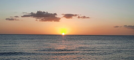 Panoramic shot of a beautiful sunset over the sea.