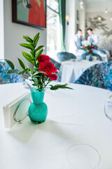Beautiful carnation flowers in vase on table