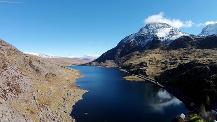 Beautiful view of a lake on the mountains under a blue sky.