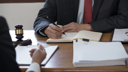 lawyer or judge counselor reading a important legal contract documents in office..