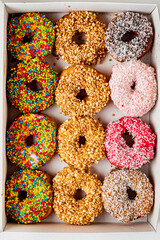 Sweet delicious glazed donuts in box,
