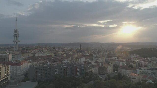 Drone footage over the buildings in Prague, Czech Republic in fog under the cloudy sky
