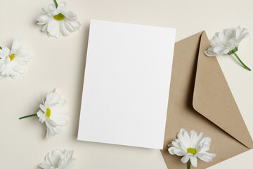 Blank invntation or greeting card mockup with envelope and flowers