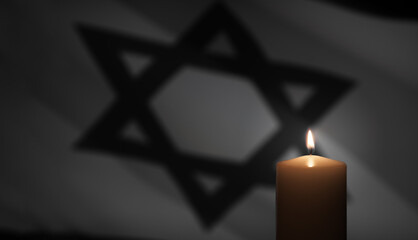 Burning candle on Israel flag background. Holocaust Remembrance Day.